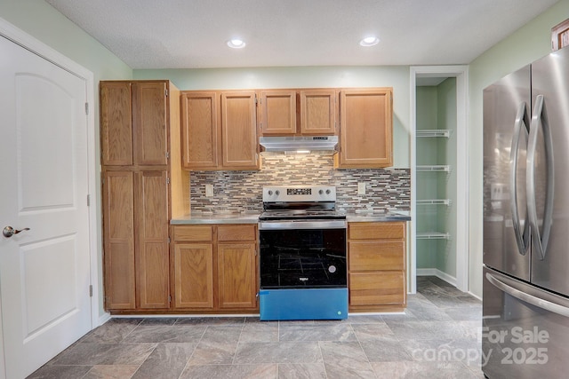 kitchen with decorative backsplash, stainless steel appliances, light countertops, under cabinet range hood, and recessed lighting