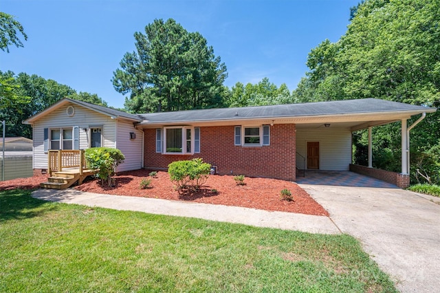 ranch-style home with a carport and a front lawn