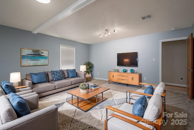 living room with light carpet and beam ceiling