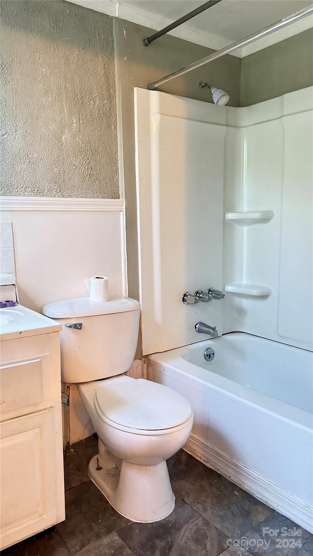 full bathroom with  shower combination, tile flooring, vanity, and toilet