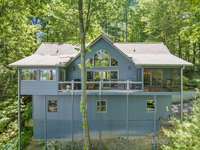 back of house featuring a wooden deck