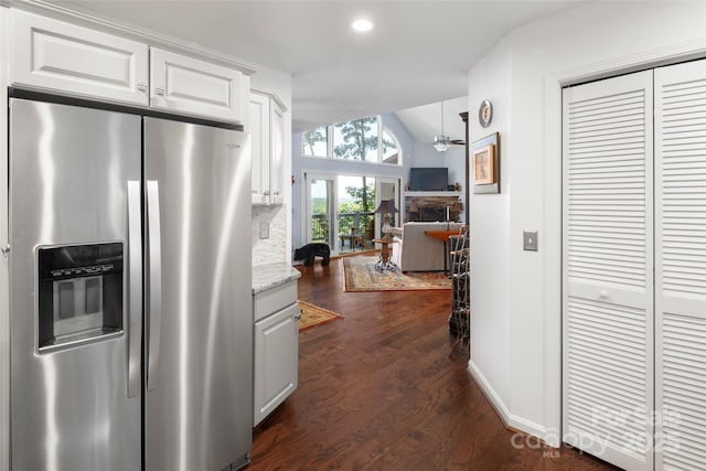 270 Ridge Dr, Saluda, NC 28773 - kitchen featuring white cabinetry, stainless steel fridge, dark wood finished floors, lofted ceiling, and baseboards