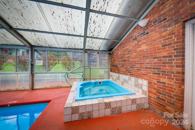 view of pool with an indoor in ground hot tub