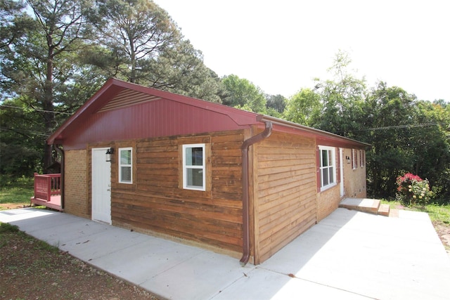 view of property exterior featuring a patio area