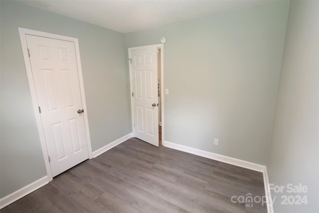 spare room featuring dark hardwood / wood-style floors