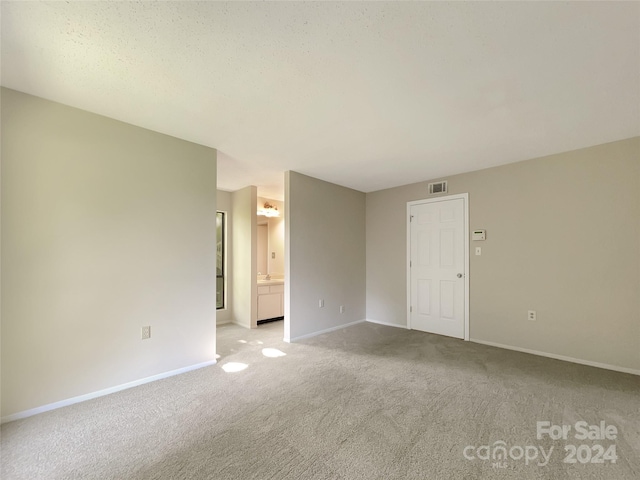 unfurnished room featuring carpet flooring