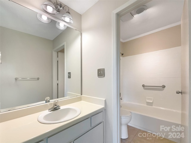 full bathroom featuring toilet, vanity, washtub / shower combination, tile floors, and ornamental molding