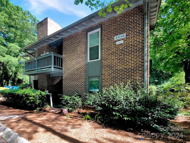 view of home's exterior featuring a balcony