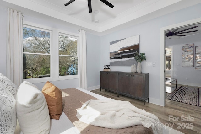 bedroom featuring hardwood / wood-style floors and ceiling fan