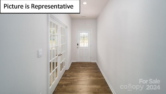 doorway featuring dark wood-type flooring