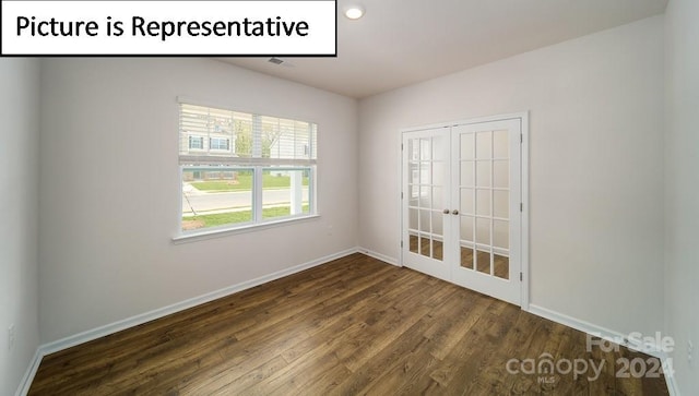 unfurnished room featuring dark hardwood / wood-style flooring