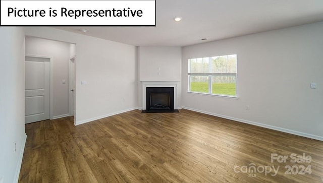 unfurnished living room with hardwood / wood-style floors