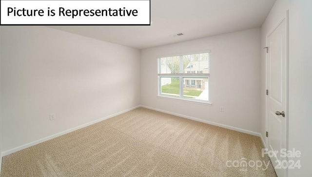 empty room with carpet flooring