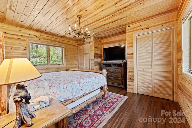 bedroom featuring a chandelier, a closet, dark hardwood / wood-style floors, and wooden ceiling