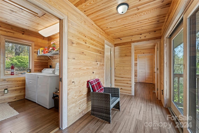 interior space with wooden ceiling, plenty of natural light, and washer and clothes dryer