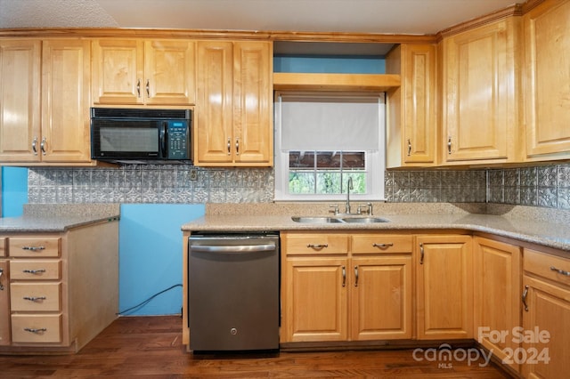 kitchen with sink, dishwasher, tasteful backsplash, and dark wood-type flooring