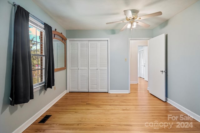 unfurnished bedroom featuring a closet, ceiling fan, and light hardwood / wood-style floors