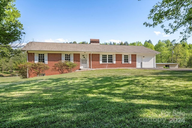 ranch-style home featuring a front yard