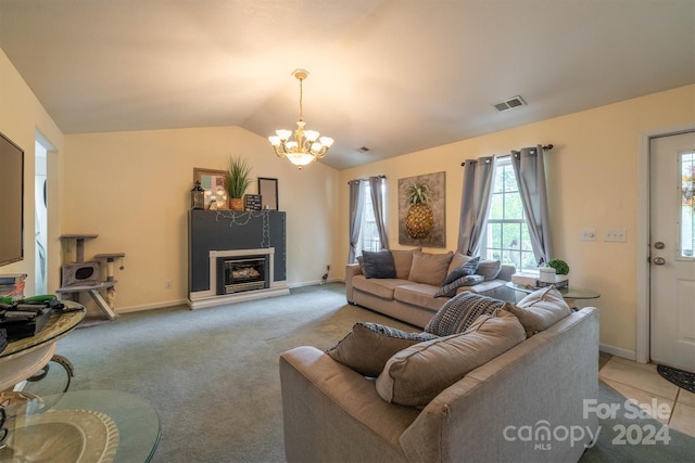 carpeted living room with lofted ceiling and a chandelier