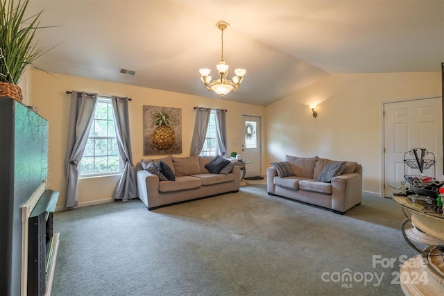 carpeted living room with lofted ceiling and an inviting chandelier