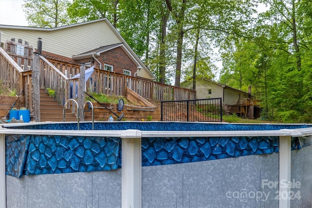 view of pool featuring a wooden deck