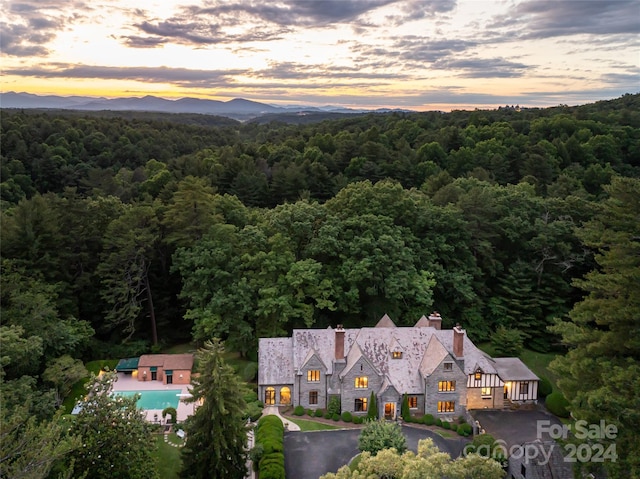 aerial view at dusk with a mountain view