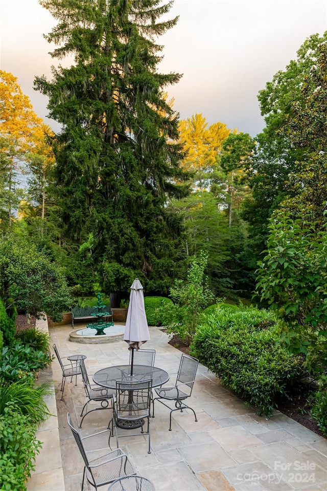 view of patio terrace at dusk