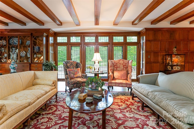 living room with beam ceiling