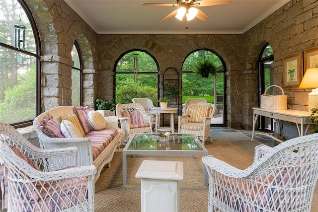 interior space with ceiling fan