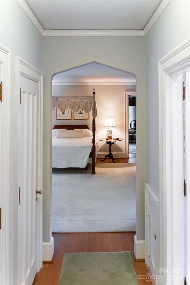 bedroom featuring hardwood / wood-style flooring and ornamental molding