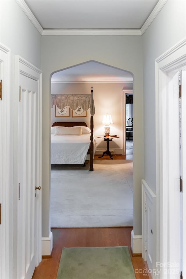 436 Vanderbilt Rd, Asheville, NC 28803 - bedroom featuring arched walkways, wood finished floors, ornamental molding, and baseboards