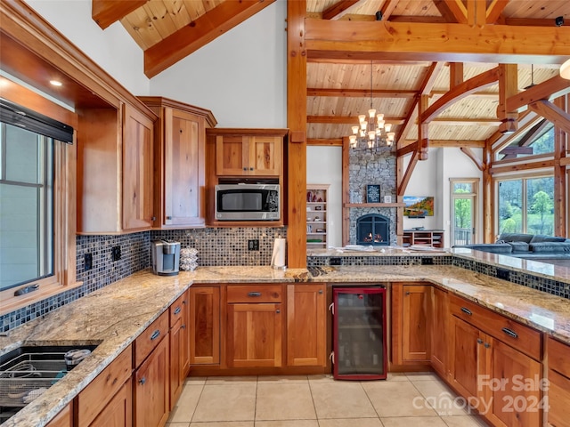 kitchen with beverage cooler, beamed ceiling, and wood ceiling