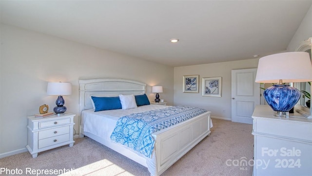 bedroom featuring light colored carpet