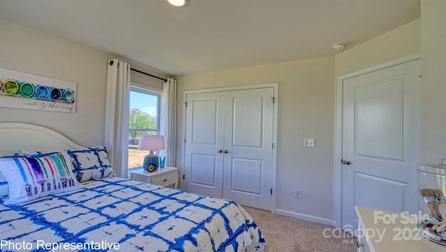 carpeted bedroom featuring a closet