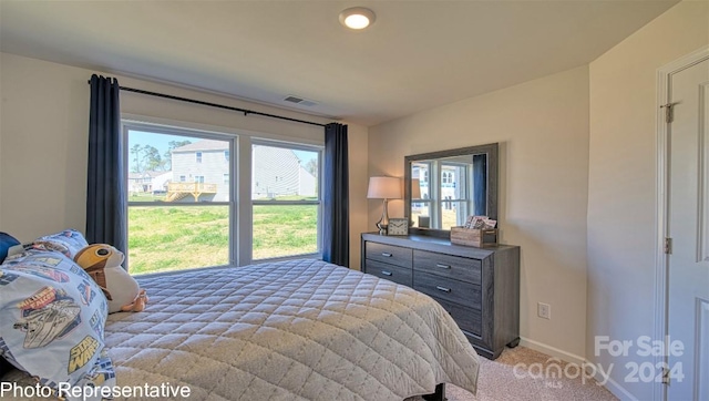 bedroom with light colored carpet