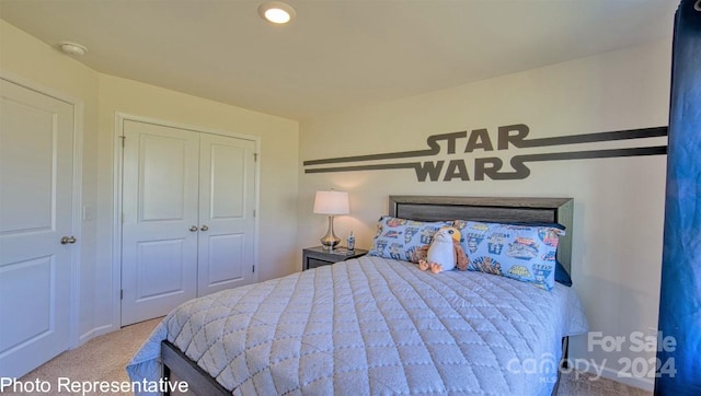 bedroom with light colored carpet and a closet