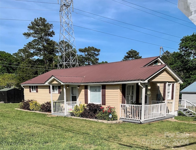 single story home with a porch and a front lawn