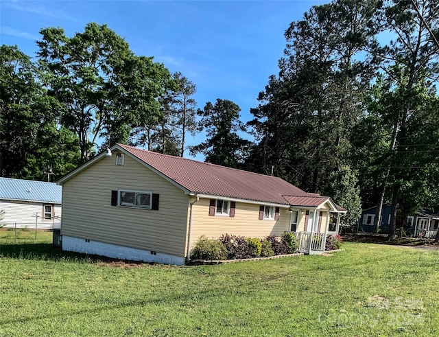 rear view of house with a yard