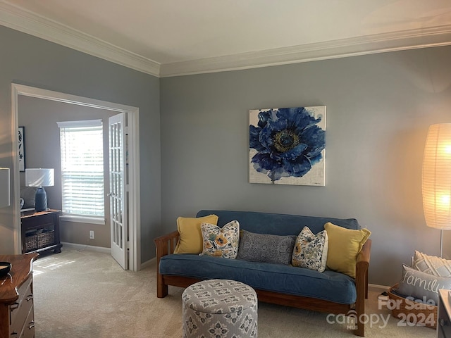 living room with crown molding and light colored carpet