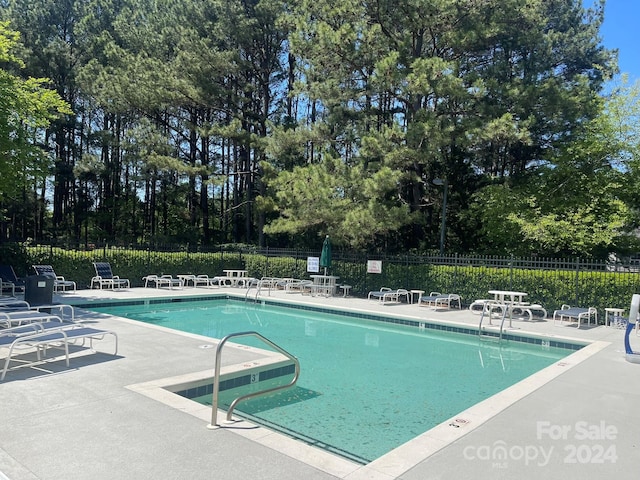 view of pool featuring a patio area