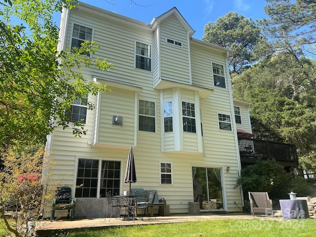 back of house with a patio area