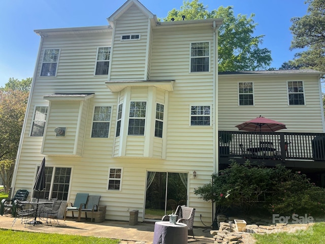 back of property featuring a patio