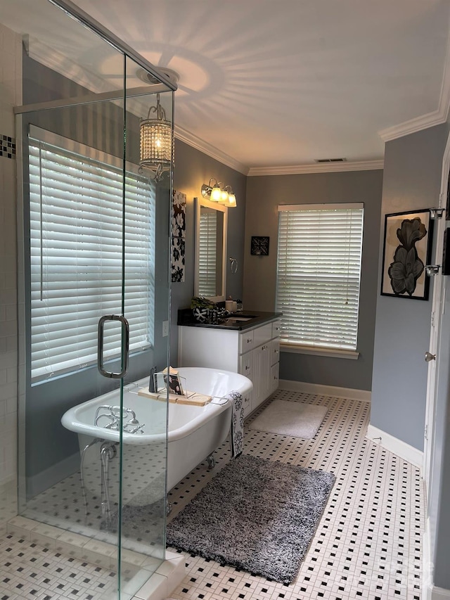 bathroom featuring tile patterned floors, shower with separate bathtub, crown molding, and vanity