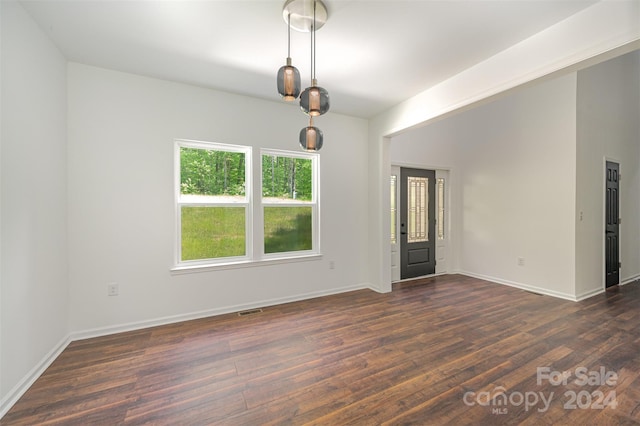 spare room featuring dark hardwood / wood-style floors