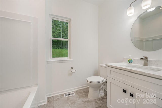 bathroom featuring vanity, toilet, and tile flooring