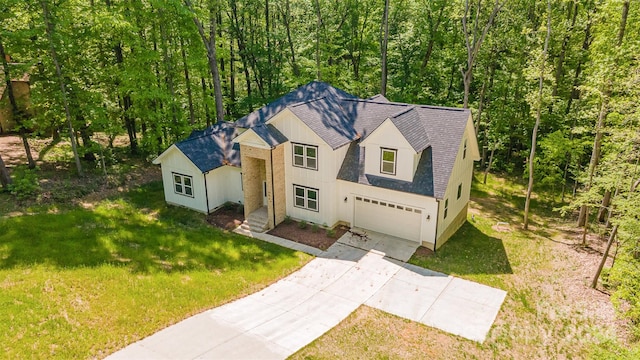 view of front of house with a garage and a front yard