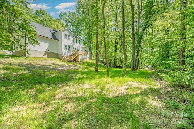 view of yard featuring a wooden deck