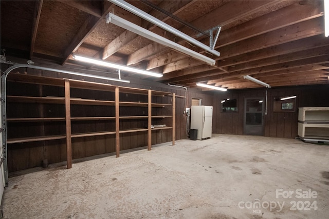 garage featuring white fridge