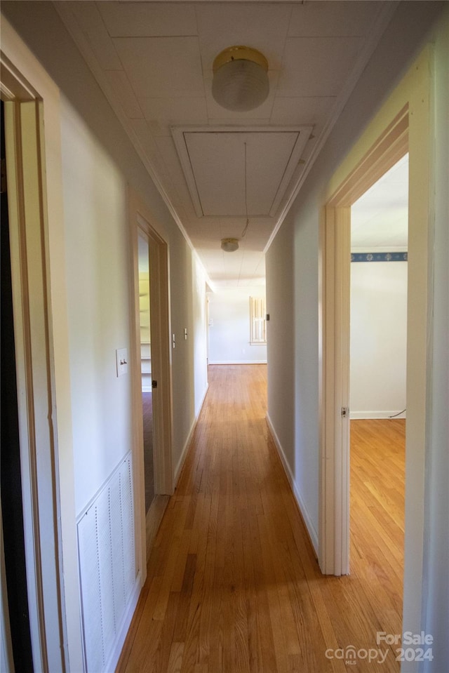 hall with wood-type flooring