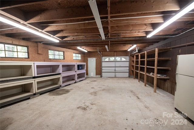 garage with white refrigerator